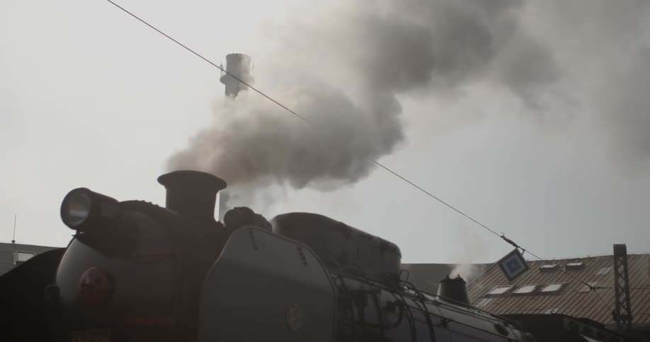 Steam rises from a locomotive