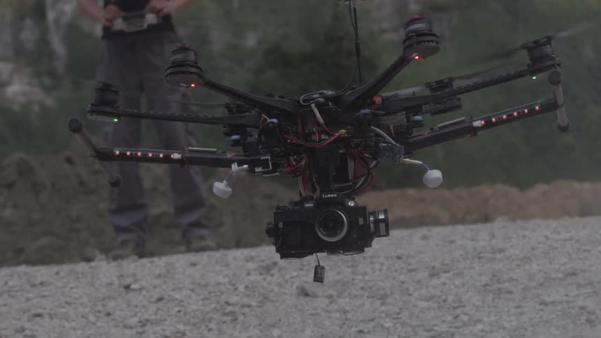 A drone slowly flies off the ground