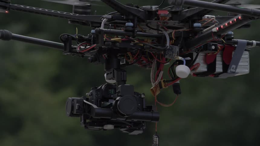 A drone flies in the sky