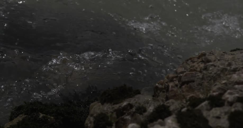 Water moves very fast crashing against the rocks