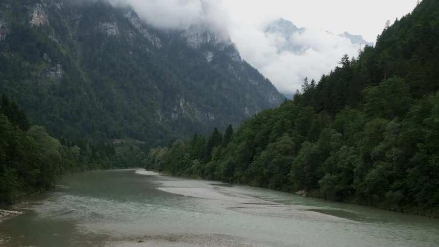 River flows at the base of a mountain