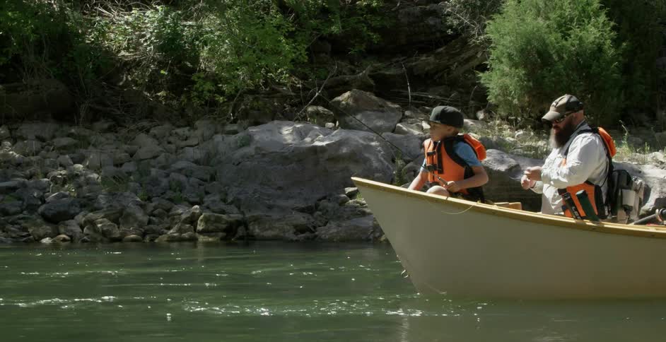Man and child in a boat on the river