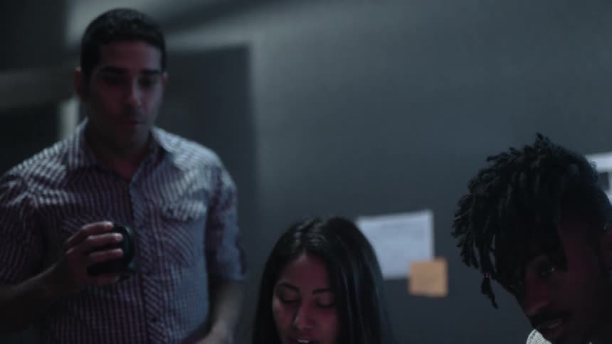 A team of employees collaborates in an office