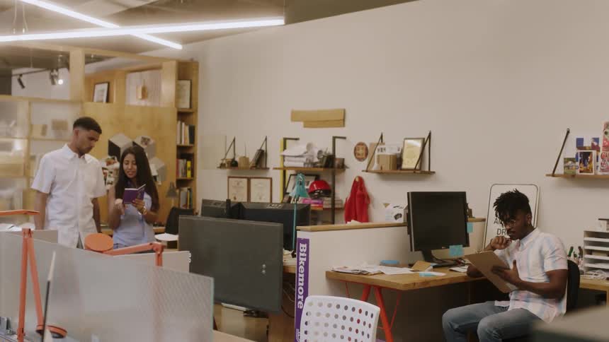 Young people are using tablet computers in an office