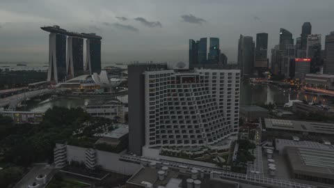 Time lapse of traffic in a city at dawn on a cloudy day