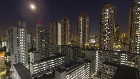 timelapse of a large brightly lit city at night