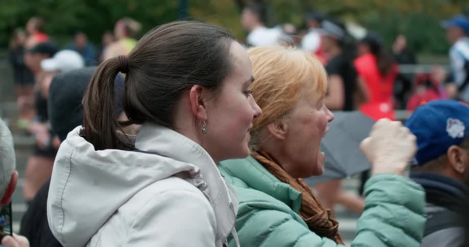 Onlookers cheer on marathon runners
