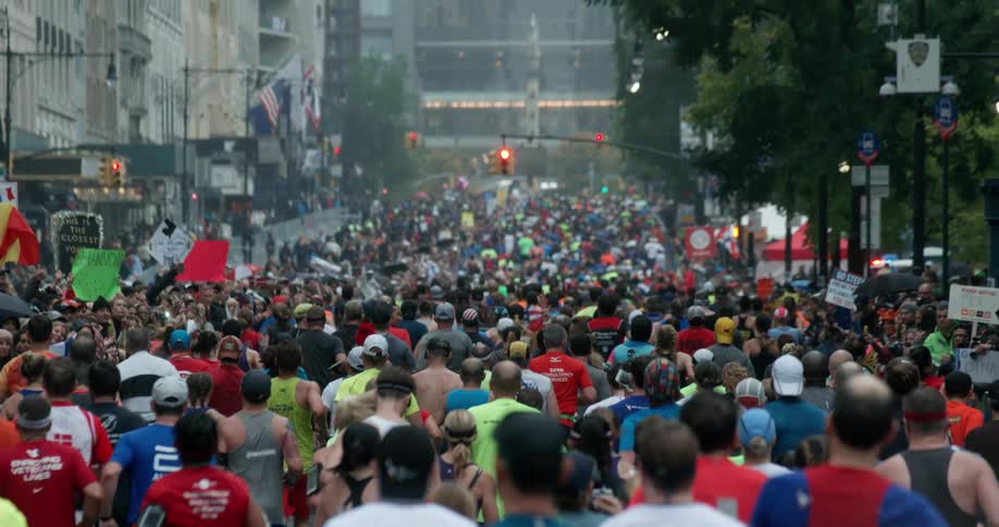 Marathoners run on a city street