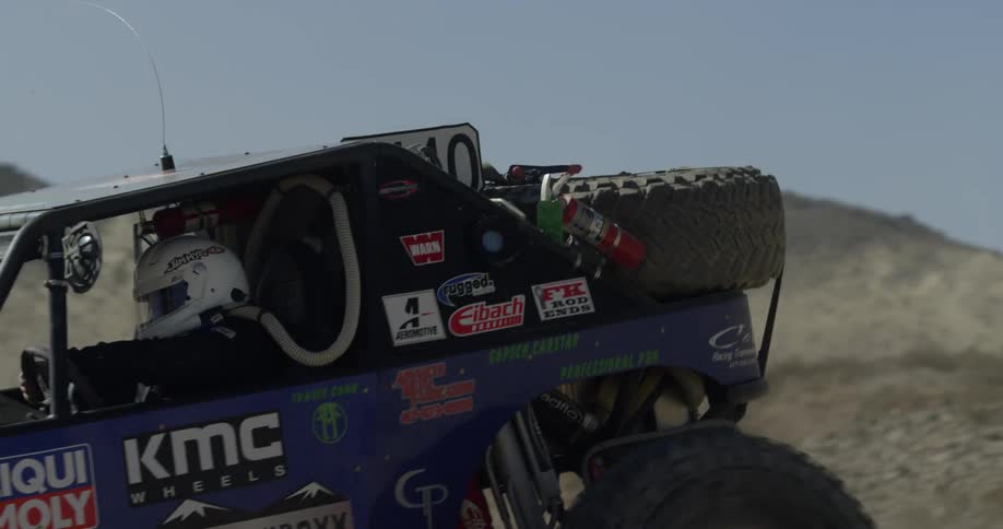 Man drives a dune buggy through the desert