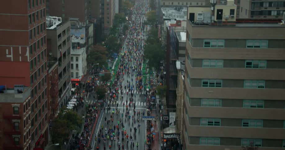 Marathon runners compete in the rain