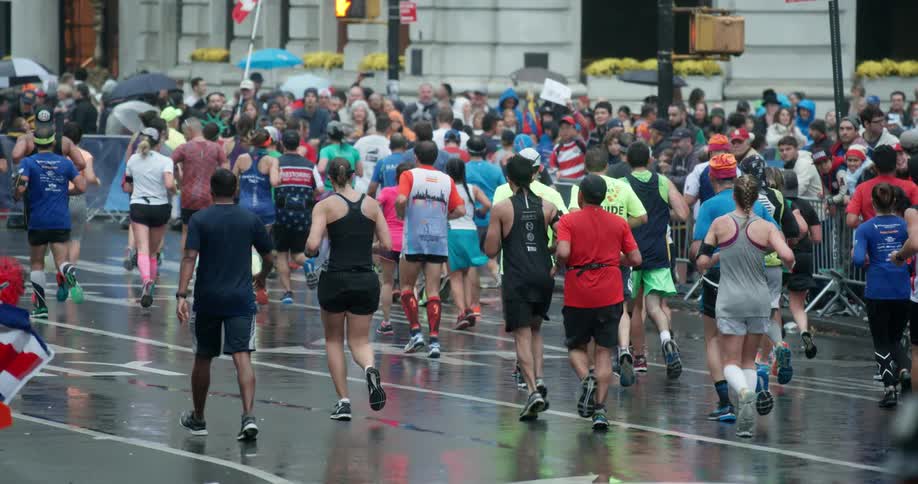 Marathon runners compete in the rain