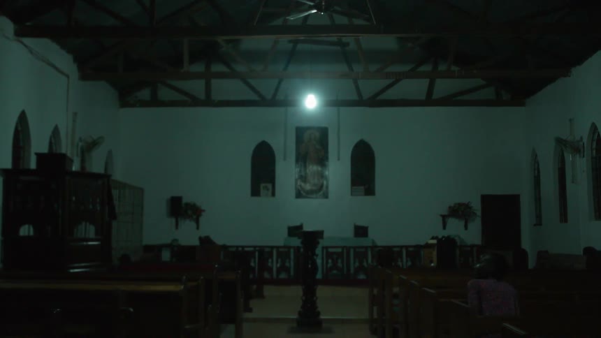 A person sits down in a church