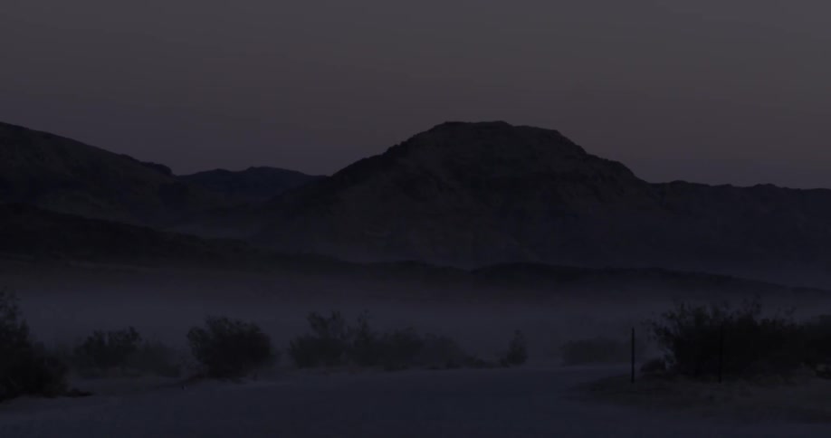 Pool of water and hills in the dark