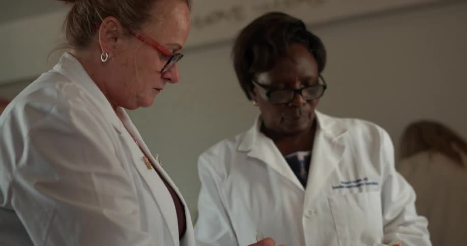Doctors dispense medicine to waiting patients