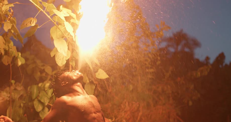 Man blows on fire and it explodes in the air