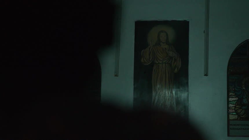 A picture of jesus hangs on the wall