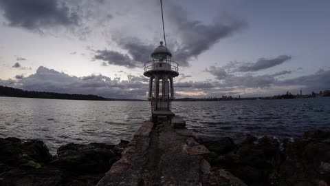 A warning light sits on the edge of the water