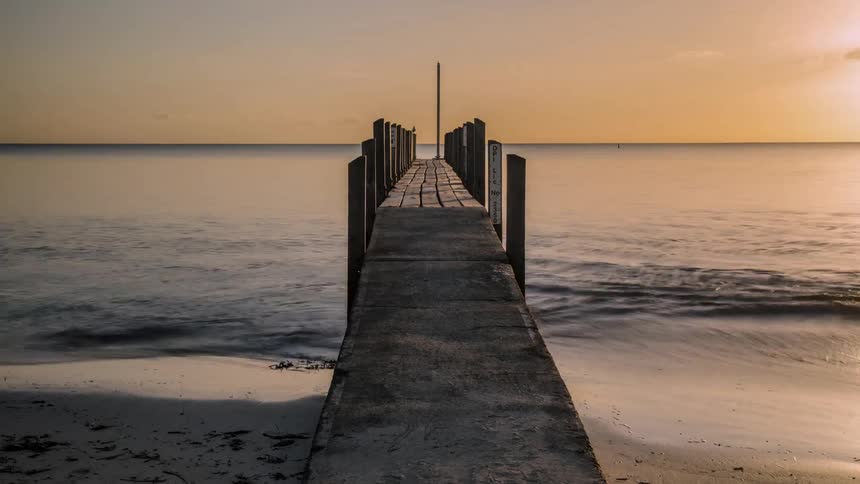 time lapse of a pier at sunrise