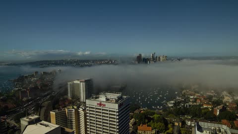 Clouds sea over a bustling city