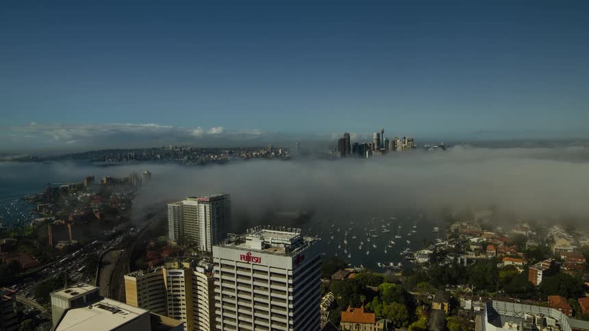 Clouds sea over a bustling city