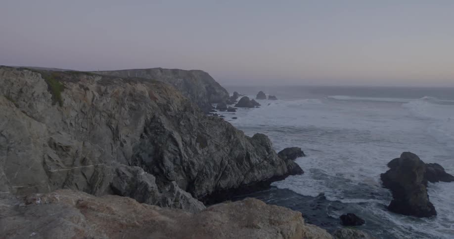 A rocky coast at dusk