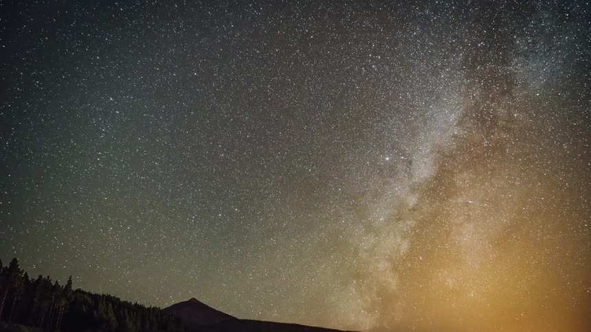 The milky way and stars are moving in the night sky