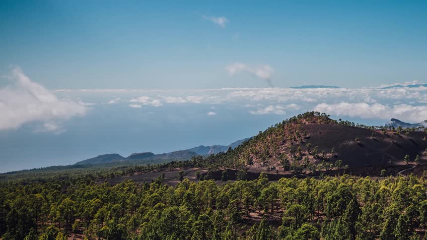 A timelapse on top of a green mountain