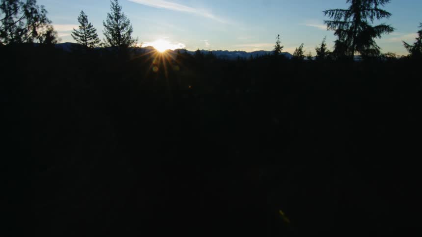 The sun rises over the mountains