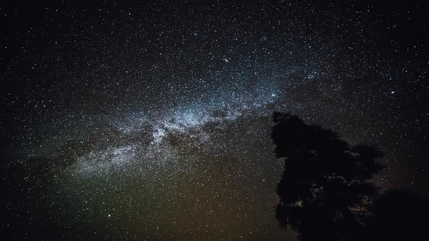 The milky way and stars are moving in the night sky