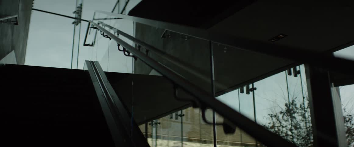 An office building handrail is filmed close up