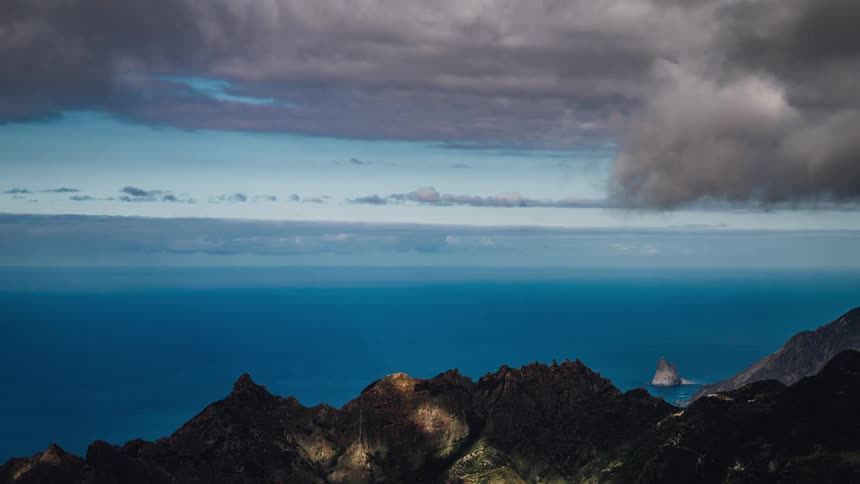 Timelapse of a mountain range and the ocean