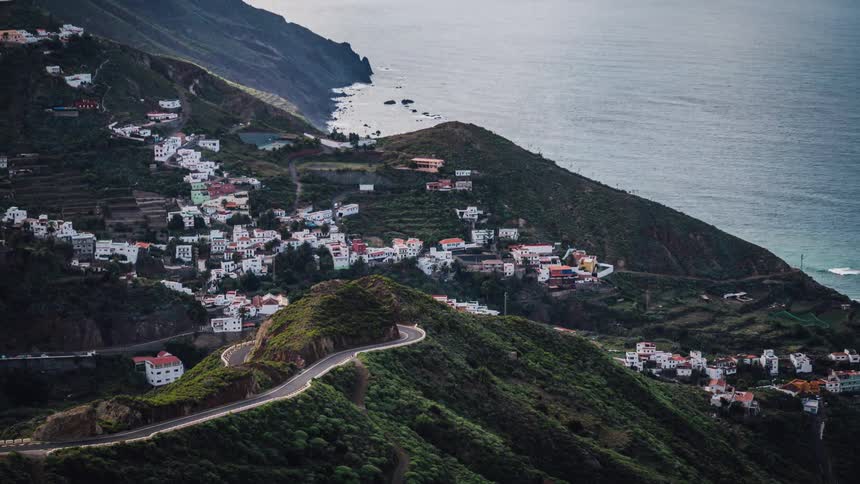 A small town is being filmed from a distance in a time lapse