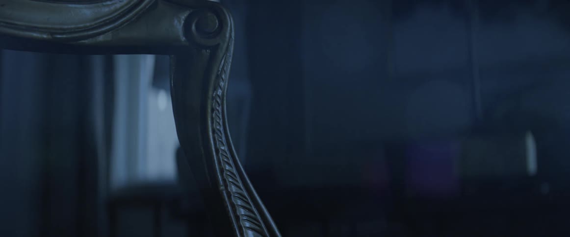 A chair is filmed close up at night
