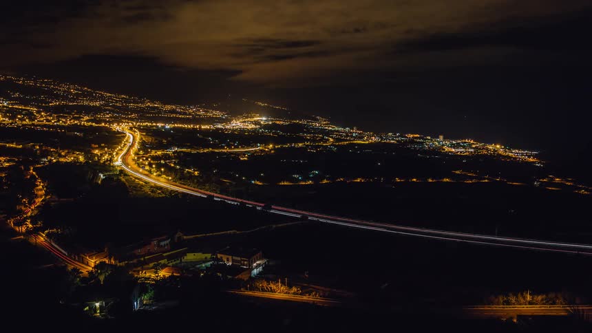 A timelapse of a highway is filmed from a distance