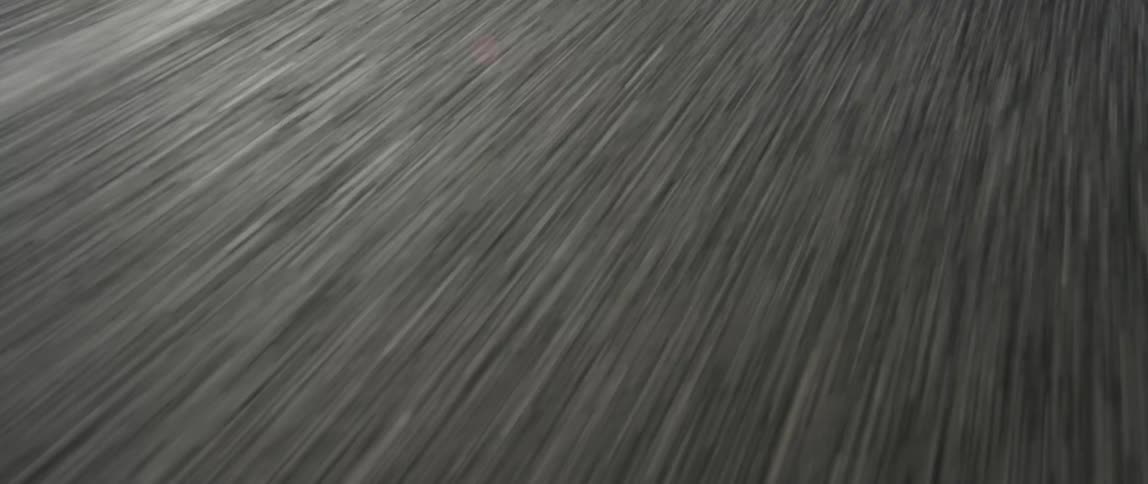 A white stripe divides a roadway