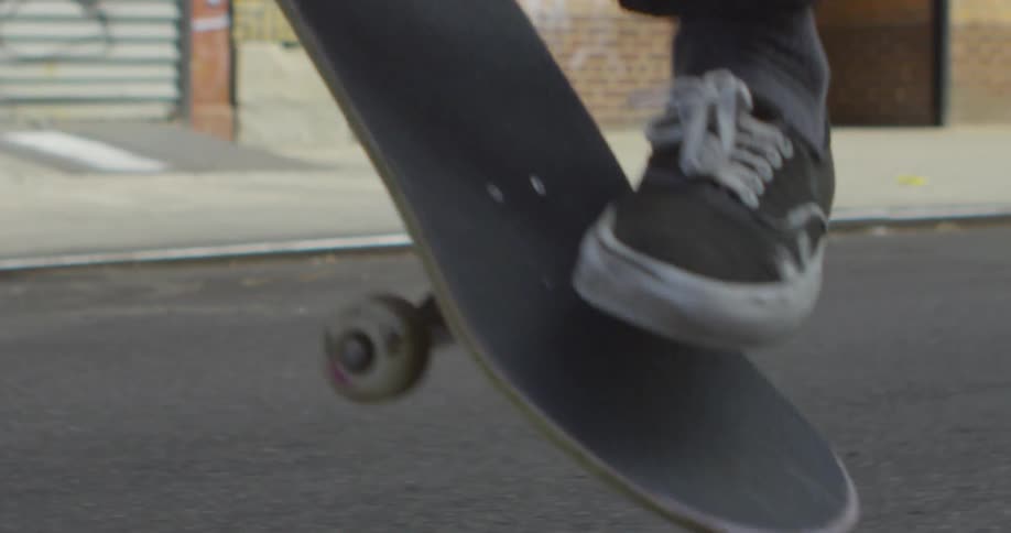 Person riding and jumps up on a skateboard