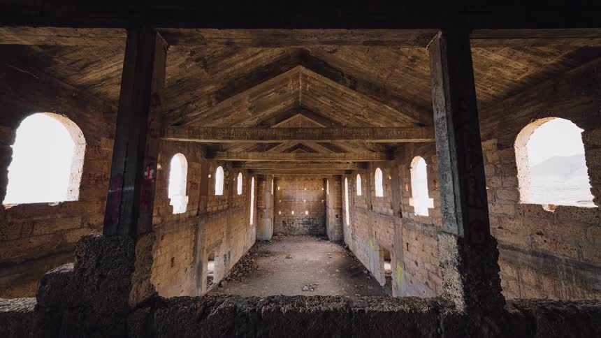 Shadow and light move in an old ruin during the day