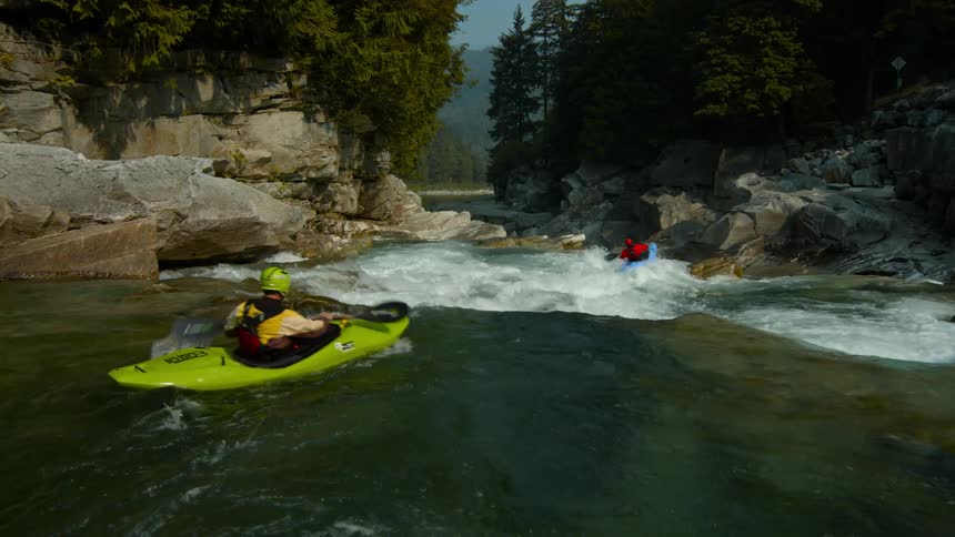 Kayaks move quickly through the rapids