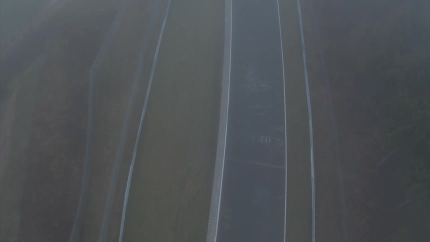 A winding road driving track is set up in the hills