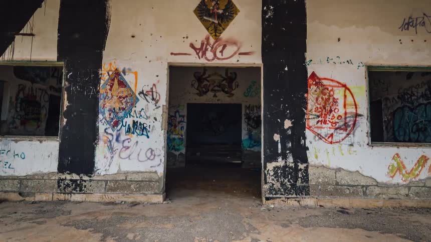 A large building covered in graffiti