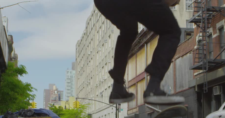 Someone is doing skateboard tricks in the street