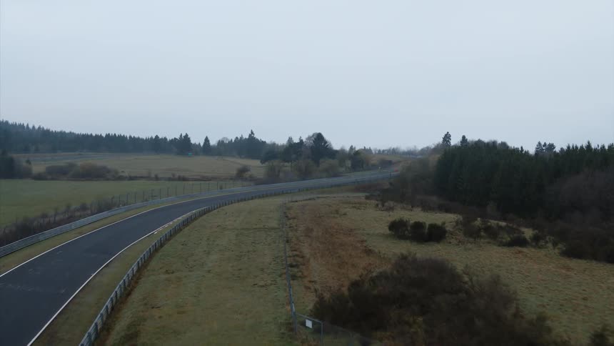 Fence and barriers are lined on each side of a driving track