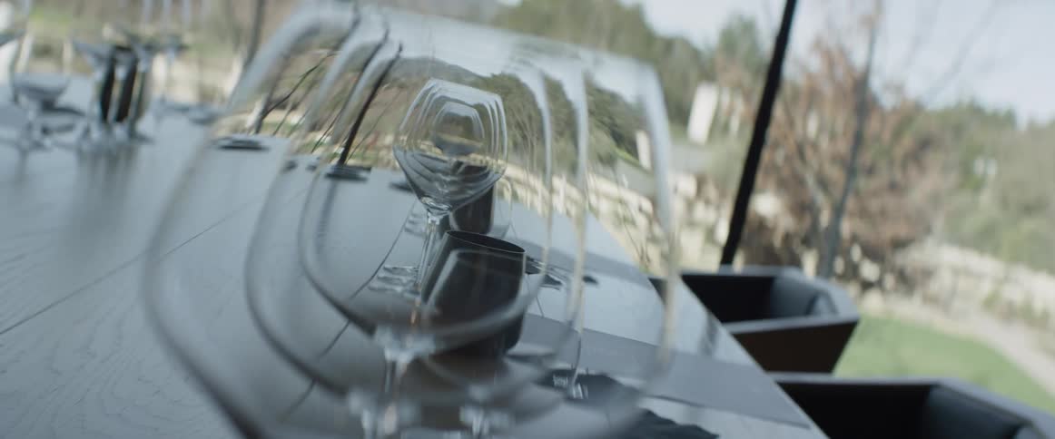 Someone is filming through empty wine glasses