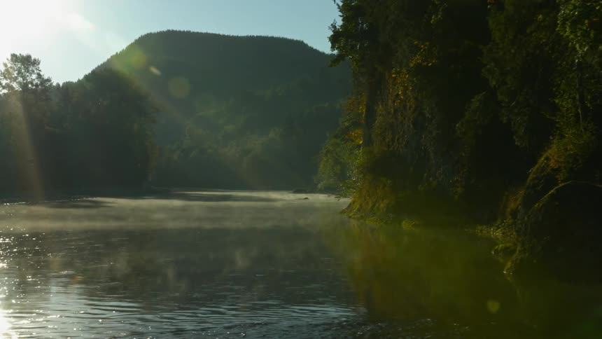 A lake sits at the base of a mountain