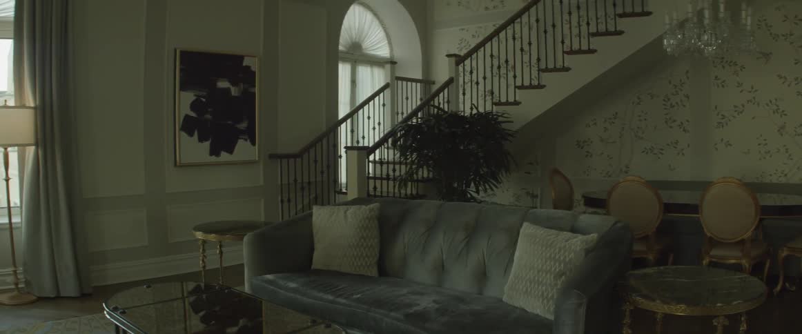 A living room sits empty during the day