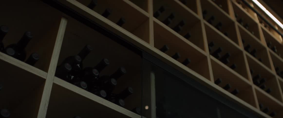 A wall filled with wine bottles