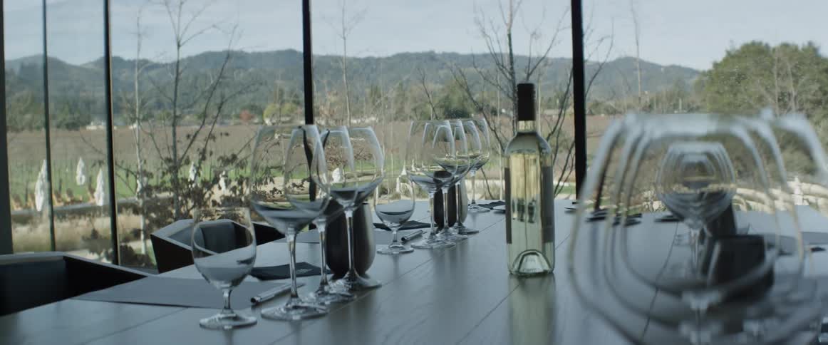 A table set with wine and glasses