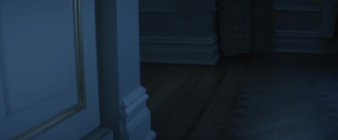 The floors of an empty dark house is being filmed