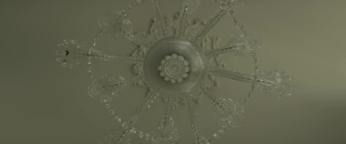 A chandelier is filmed from the bottom
