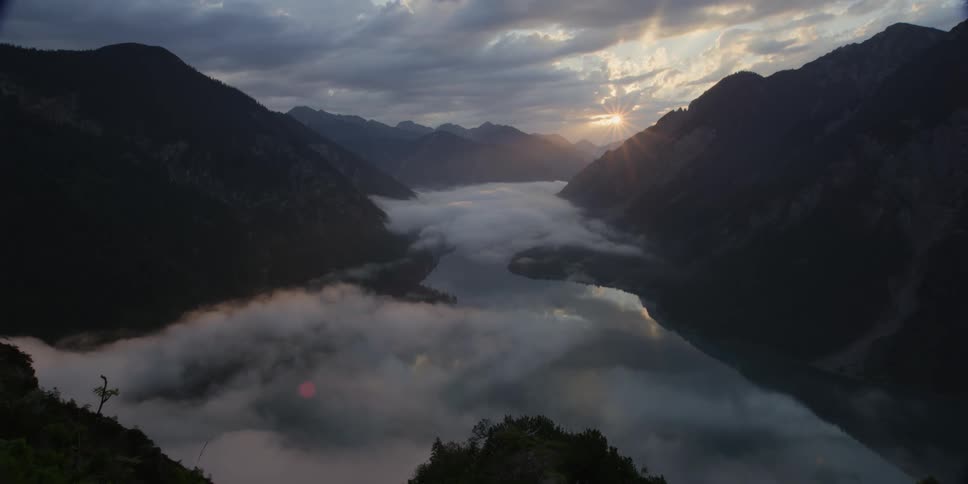 A misty river between mountains